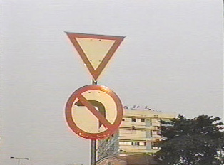 Yield sign and no left turns sign