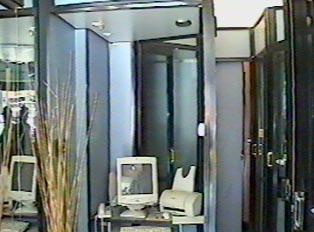Private booths with computer in foreground