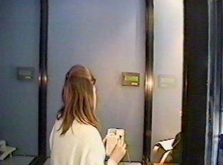 Person making a call inside the booth