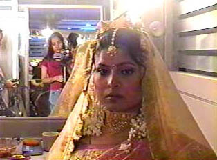 A bride on her wedding day at the beauty parlor
