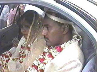 Bride and groom in a car