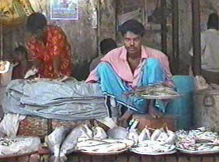 Vendors selling fish in an open-air market