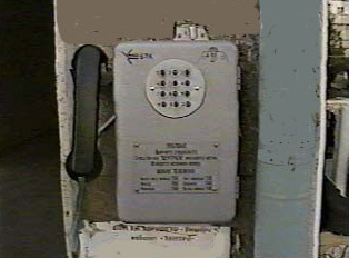 A pay phone that uses phone tokens (gettoni)