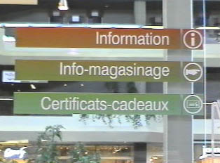 Directional signs for customer service inside a mall