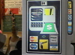 ATM  machine in a mall; cards that can be used with the machine
