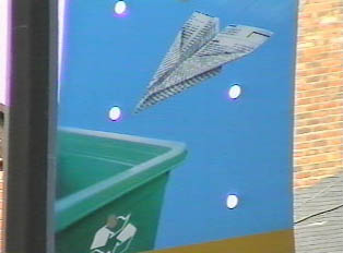'Recycling a kid's game'--sign above a recycling box