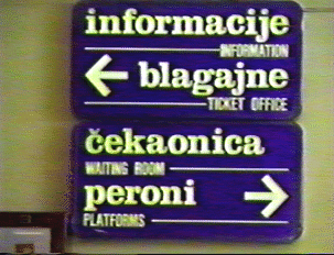 Directional sign: information, ticket office, waiting room, and platforms  