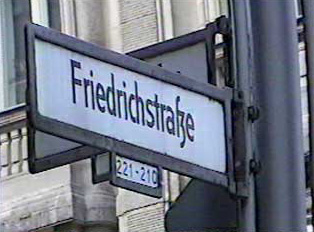 Street sign, the numbers indicate buildings 221-210