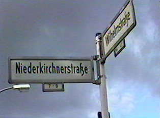 Another street sign, with building numbers