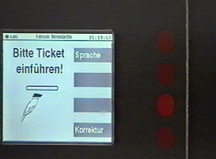 Insert your ticket in the slot on the right