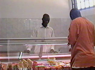 Buying meat at the meat counter of the supermarket