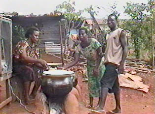 Buying banku from a way-side food vendor