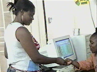 Young woman paying to use internet connection