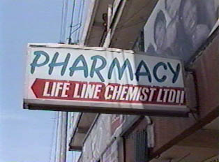 A Pharmacy sign above the entrance