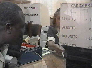 Man buying phone cards at the post office