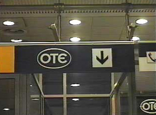 Telephone sign inside airport