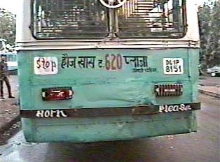 Sign on back of bus indicating bus number
