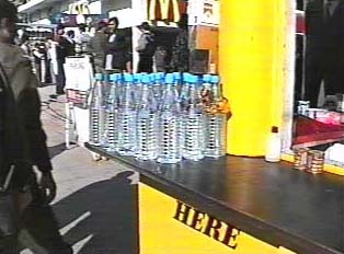 Bottles of Bisleri water at a roadside food stand
