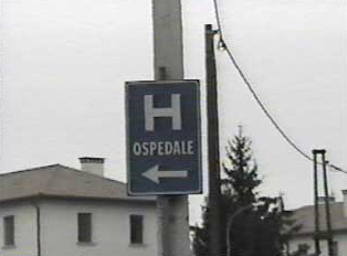 Road sign indicating direction to hospital