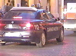 Police car displaying the 112 phone for the police