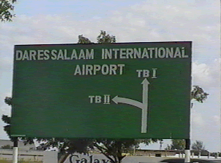 Traffic sign indicating direction of airport gates
