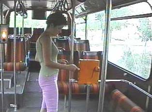 Woman validating her bus ticket