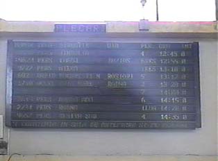 'Departures sign with train number, platform,  and the time it is departing
