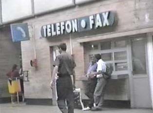 Sign for public telephones and fax machines inside train station