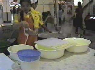Woman preparing Thai noodles