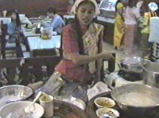 Woman demonstrating how to make a Thai dessert