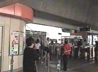 People waiting inside monorail station