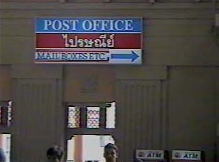 Sign for post office inside train station
