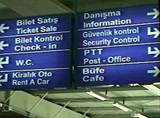 Signs in Turkish and English for services inside the airport