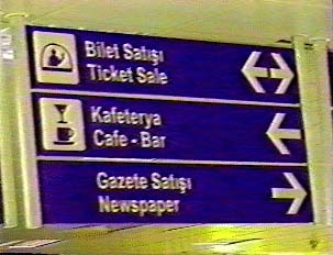 Signs in Turkish and English for services inside the airport