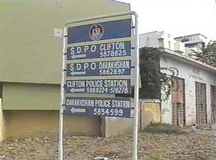 Sign for police stations with phone numbers