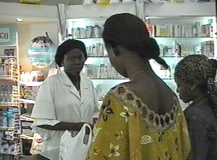 Someone buying medicine at a pharmacy