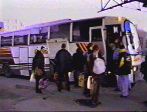 People boarding a bus