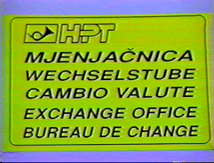 A yellow sign for a money exchange office