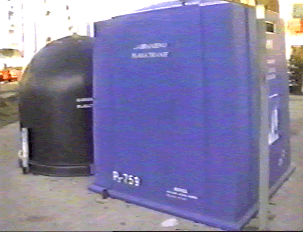 A large blue recycling container