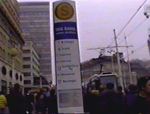 A tall, white sign providing tram information