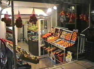 A small fruit store at night