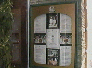 A menu posted to the front of a restaurant