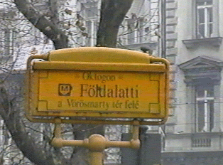 A yellow subway sign