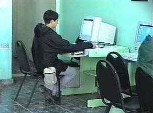 Person on a computer in an internet cafe