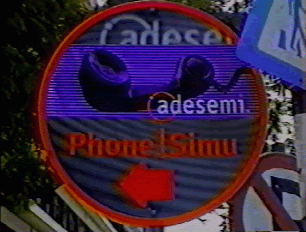 A sign indicating a public phone line