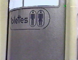 A door with a sign indicating male and female restrooms