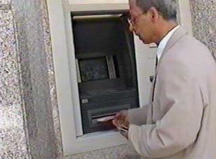 A man withdrawing cash from an ATM