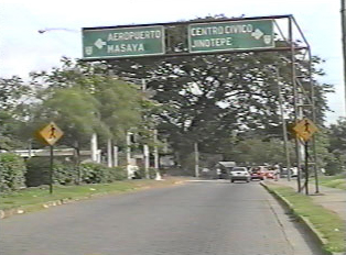 A road with green directional signs