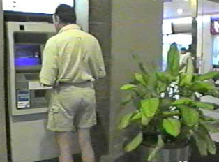 A person at an ATM
