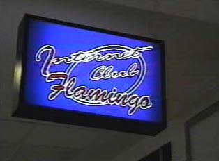 A sign for the Flamingo Internet Cafe